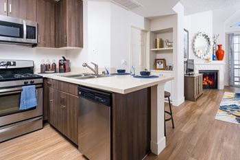 Living room and kitchen with wood flooring